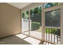 View of the screened-in back patio offering a serene outdoor space at 112 Sabiston Ct, Cary, NC 27519