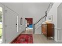 Spacious foyer with hardwood floors and grand staircase at 120 E Laurenbrook Ct, Cary, NC 27518