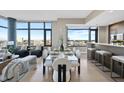 Elegant dining area featuring a glass table, modern chairs, and stunning city views at 122 N Harrington St # 1025, Raleigh, NC 27603