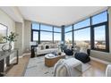 Stylish living room filled with natural light from the large windows at 122 N Harrington St # 1025, Raleigh, NC 27603