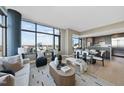 Open-concept living space boasts large windows, a modern design, and a bright, airy atmosphere at 122 N Harrington St # 1025, Raleigh, NC 27603