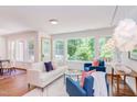Bright living room featuring modern furnishings, natural light, and views of the outdoors at 1409 Valley Run, Durham, NC 27707