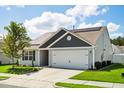 Charming one-story home with a well-manicured lawn, an attached garage and a installed Solar Panels at 1561 Dorsett Ln, Creedmoor, NC 27522