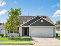 Charming one-story home with a well-manicured lawn, an attached garage and a installed Solar Panels at 1561 Dorsett Ln, Creedmoor, NC 27522