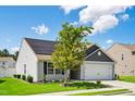 Charming one-story home with a well-manicured lawn, an attached garage and a installed Solar Panels at 1561 Dorsett Ln, Creedmoor, NC 27522