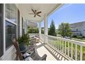 Inviting covered porch featuring rocking chairs and comfortable outdoor seating at 1604 Upper Park Rd, Wake Forest, NC 27587
