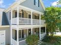 Charming two-story home with a double porch, perfect for relaxing outdoors at 1617 Heritage Garden St, Wake Forest, NC 27587
