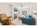 Cozy living room with fireplace, hardwood floors, and sliding door to the patio at 1617 Heritage Garden St, Wake Forest, NC 27587
