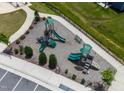 Aerial shot of a modern playground with slides, benches, and landscaping for Gathering enjoyment at 1745 Ripley Woods St, Wake Forest, NC 27587