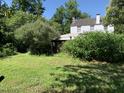 Expansive backyard features mature trees and a grassy lawn at 1800 Avondale Dr, Durham, NC 27701