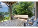 Spacious wooden deck featuring a built-in bench, perfect for outdoor relaxation and enjoyment at 2053 Thornblade Dr, Raleigh, NC 27604