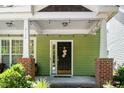 Inviting front porch with stylish accents and ample space for seating at 2112 Dunn Rd, Raleigh, NC 27614