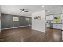 Spacious living room featuring hardwood floors, modern wall trim, and plenty of natural light at 2317 Bertie Dr, Raleigh, NC 27610