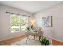 Bright office space with hardwood floors, large window, and neutral decor at 2644 Bloomsberry Ridge Dr, Fuquay Varina, NC 27526