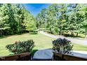 Inviting view of the long driveway leading up to the house, surrounded by lush greenery at 3564 Lower Moncure Rd, Sanford, NC 27330