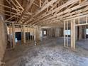 Unfinished interior view highlighting the stud framing, roof beams, and spacious layout at 4026 N Nc 581 Hwy, Kenly, NC 27542