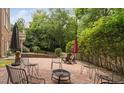 Brick patio featuring outdoor seating and a fire pit for entertaining at 409 Englewood Dr, Chapel Hill, NC 27514