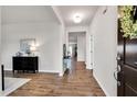 Inviting foyer with wood flooring, neutral paint, leading to living areas and bedrooms at 4102 Catfish Way, Durham, NC 27703
