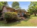 Quaint home featuring a covered front porch, perfect for enjoying the outdoors at 416 Forrest St, Hillsborough, NC 27278