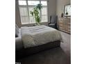 Comfortable bedroom with large windows, neutral colors, and stylish furniture at 433 Turnberry Dr, Mebane, NC 27302