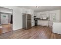 Kitchen with stainless steel appliances, white cabinets, wood countertops and a stainless steel refrigerator at 500 Ellen Dr, Knightdale, NC 27545