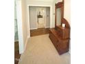 Welcoming foyer features tile flooring and a decorative wood bench at 5112 Stephens Ln, Durham, NC 27712