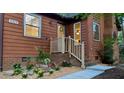 Charming home entrance featuring manicured landscaping and decorative lighting at 5315 Mccormick Rd, Durham, NC 27713