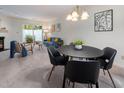 Open-concept dining area next to the living room filled with natural light and stylish furnishings at 6 Parsons Chase Ln, Durham, NC 27713