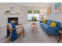 Inviting living room featuring a fireplace, comfortable seating, and access to an outdoor area at 6 Parsons Chase Ln, Durham, NC 27713