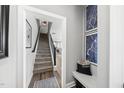 Inviting entryway with staircase, stylish decor, and seamless transition to living space at 6300 Pleasant Pines Dr # 101, Raleigh, NC 27613
