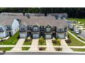 Aerial view of modern townhomes with landscaped yards and convenient parking at 706 Ambrose Hill Lane Ln, Wendell, NC 27591
