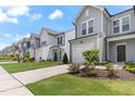 Charming row of townhomes with well-manicured lawns and inviting curb appeal at 706 Ambrose Hill Lane Ln, Wendell, NC 27591