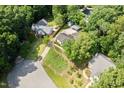 Overhead view of a home with mature trees and lush greenery at 716 Sandra St, Garner, NC 27529