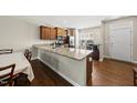 Eat-in kitchen features granite countertops and stainless steel appliances at 8885 Commons Townes Dr, Raleigh, NC 27616