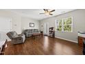 Cozy living room with ample seating and natural light at 8885 Commons Townes Dr, Raleigh, NC 27616