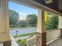 Spacious front porch offering scenic neighborhood views and a tranquil outdoor space at 997 Windy Rd, Apex, NC 27502