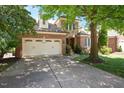 Beautiful brick home featuring an attached two-car garage and a well-maintained concrete driveway at 107 Sonoma Valley Dr, Cary, NC 27518