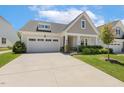 Beautiful one-story home with a two-car garage and well-manicured front lawn at 149 Ivory Ln, Raleigh, NC 27610