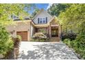 Beautiful two-story home with brick and stone accents, well-maintained landscaping, and an inviting entrance at 150 Luxorwind Dr, Garner, NC 27529