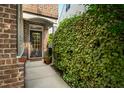 Inviting front entrance features a charming front door, beautiful brick work, and lush landscaping at 2007 October Dr, Durham, NC 27703