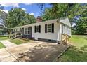 A spacious driveway leading to the side entrance of a renovated home at 202 Purvis St, Garner, NC 27529