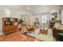 Stylish living room featuring hardwood floors, fireplace, and lots of comfortable seating at 211 W Trinity Ave, Durham, NC 27701