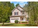 Charming two-story home featuring a well-maintained lawn and an attached two-car garage at 2555 Winding Creek Ln, Franklinton, NC 27525
