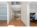 Inviting foyer with gleaming hardwood floors and a view into the spacious living area at 406 Dairy Farm Dr, Hillsborough, NC 27278