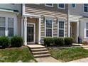 Close up of a charming townhome entrance with neat landscaping and a visible house number at 4536 Sugarbend Way, Raleigh, NC 27606