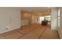 Spacious living room with abundant natural light, showcasing the open floor plan and contemporary design at 5031 Se Jowetts Walk Dr # 28, Cary, NC 27519