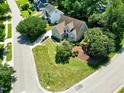 Expansive property with lush landscaping, mature trees, and a neatly manicured lawn at 917 Haddon Hall Dr, Apex, NC 27502