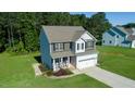 An aerial shot of the two-story home situated on a green lot at 933 Weatherby Ln, Creedmoor, NC 27522