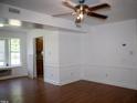 Spacious living area with hardwood floors and natural light from a window at 103 Sara Dr, Nashville, NC 27856