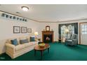 Cozy living room with fireplace, ample natural light, and neutral décor at 14 Quintin Pl, Durham, NC 27705